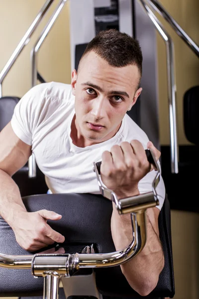 Young man in the gym — Stock Photo, Image