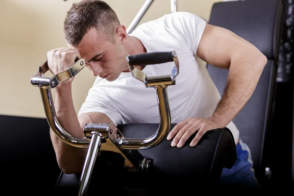 Young man in the gym — Stock Photo, Image