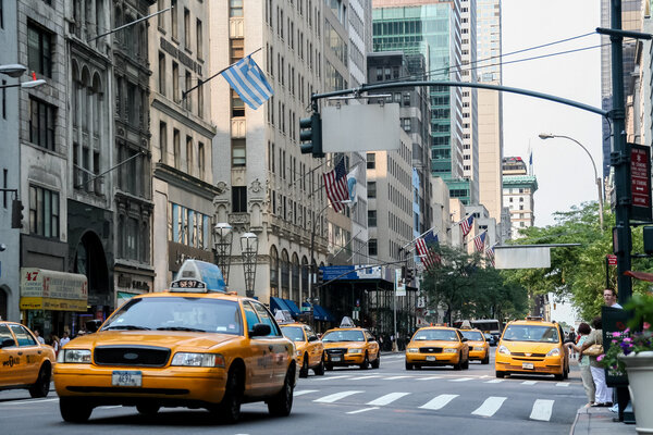 Taxi cabs on the street of New York City. There is 13,237 taxi cabs operating in New York City which have 241 million annual taxi passengers.