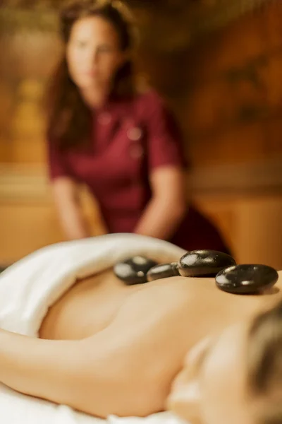 Hot stone massage therapy — Stock Photo, Image