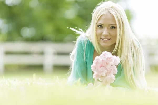 Young blond woman in the field — Stock Photo, Image