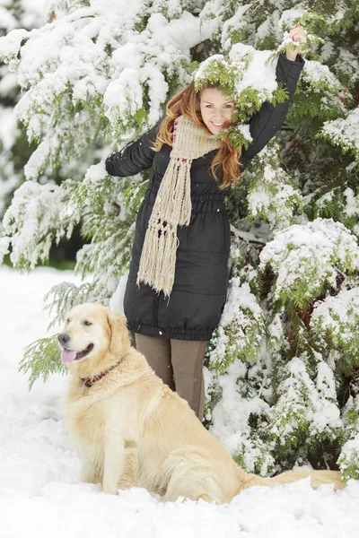 Young woman with dog at winter — Stock Photo, Image