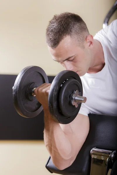 Young man in the gym — Stock Photo, Image