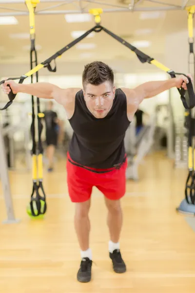 Young man training in the gym