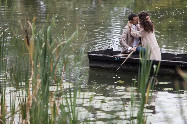 Loving couple in the boat — Stock Photo, Image