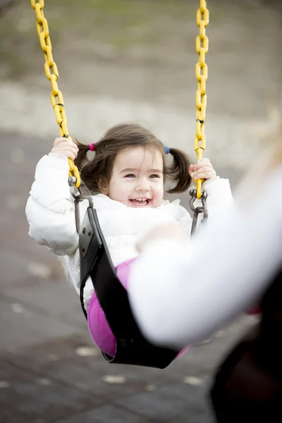 Little girl at the swing — Stock Photo, Image