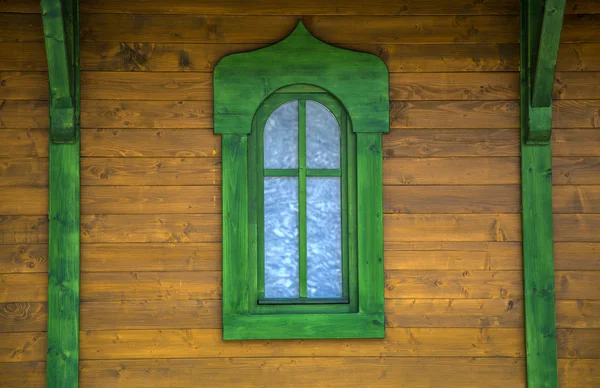 Green window on the wooden house — Stock Photo, Image