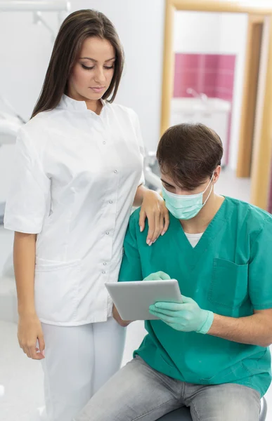 Dentists with tablet — Stock Photo, Image