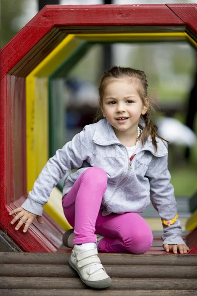 Menina no parque infantil — Fotografia de Stock