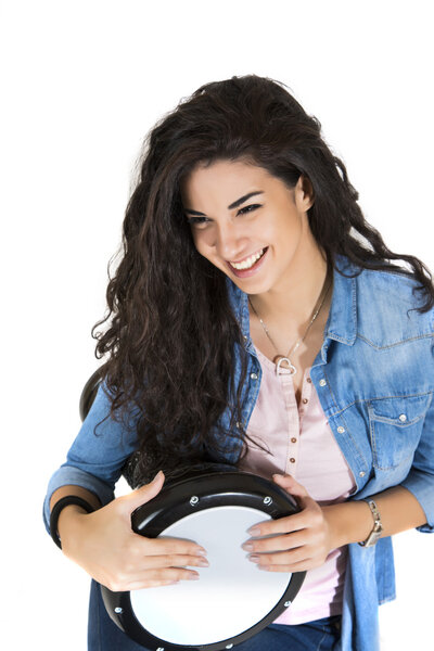 Young woman playing drum