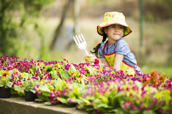 Little girl in the garden Royalty Free Stock Images