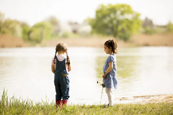 Two little girls fishing — Stock Photo, Image