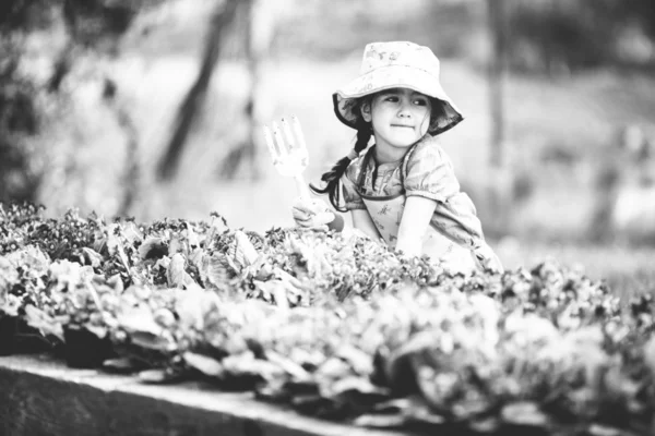 Little girl in the garden — Stock Photo, Image