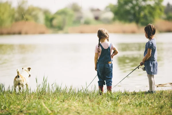 Two little girls at fishing — Stock Photo, Image