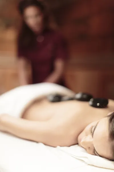 Hot stone massage therapy — Stock Photo, Image