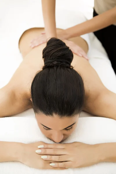 Pretty young woman having a massage — Stock Photo, Image