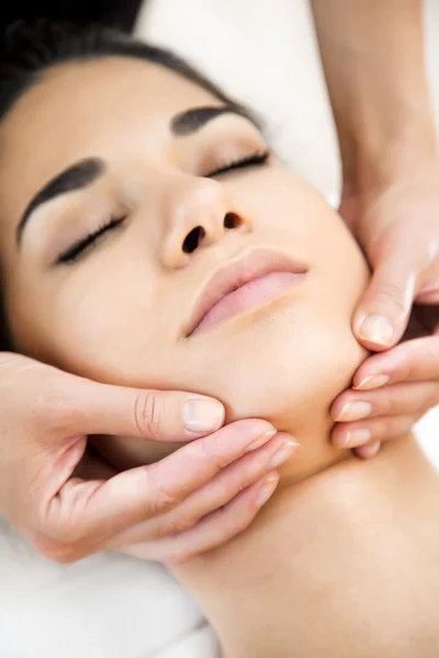 Pretty young woman having a massage — Stock Photo, Image