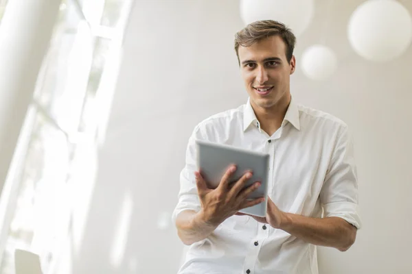 Man with tablet in office — Stock Photo, Image