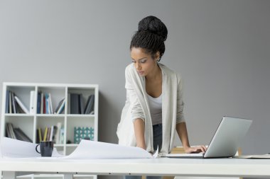 Young woman in the office clipart