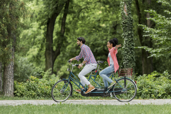 Couple riding on bicycle