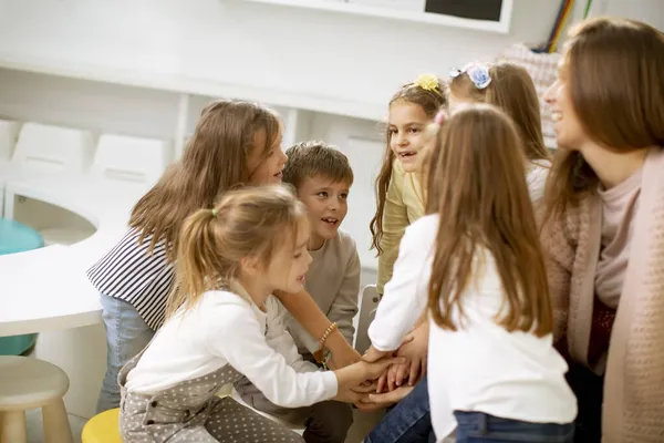 Group Cute Preschool Kids Put Hands Together Nursery Teacher — Stock Photo, Image