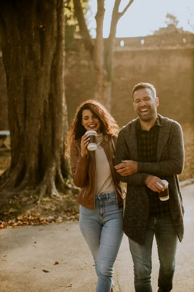 Handsome Young Couple Walking Autumn Park Coffee Cups Hands — Stock Photo, Image