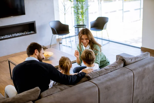 Smiling Young Family Watching Together Sofa Living Room — 图库照片