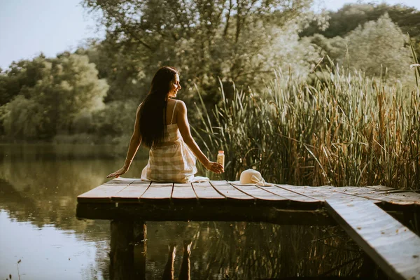 Young Woman Relaxing Wooden Pier Calm Lake Hot Summer Day — Stockfoto