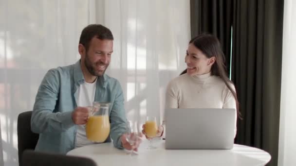 Young Couple Living Room Drinking Orange Juice — Vídeo de Stock