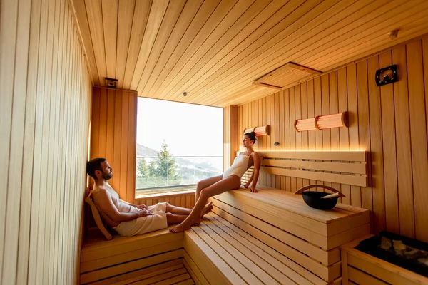 Handsome Young Couple Relaxing Sauna Watching Winter Forest Window — Stock Photo, Image