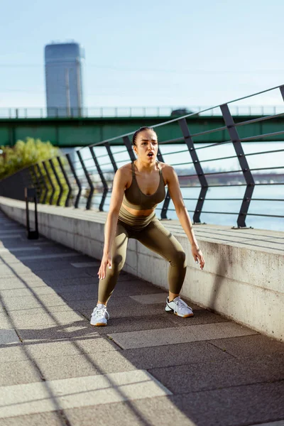 Pretty Young Woman Sportswear Stretching River Promenade — Stock fotografie