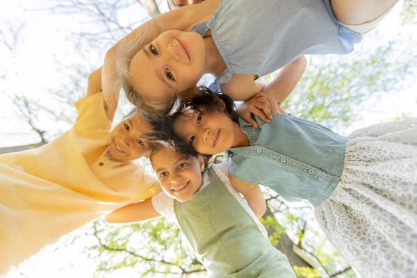 Group Cute Asian Caucasian Happy Kids Huddling Looking Camera Smiling — Foto de Stock