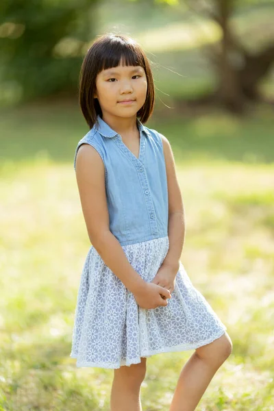 Cute Little Korean Girl Standing Park Sunny Day — Stockfoto