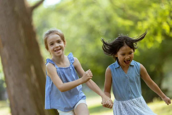 Caucasian Asian Girl Running Together Park — Stock Photo, Image