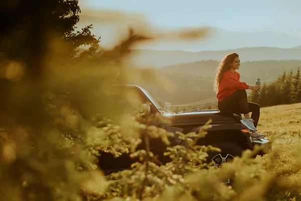 Pretty Young Woman Relaxing Terrain Vehicle Hood Countryside — Stock fotografie