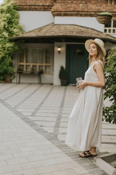 Pretty Young Woman Hat Drinking Cold Lemonade Resort Garden — Zdjęcie stockowe