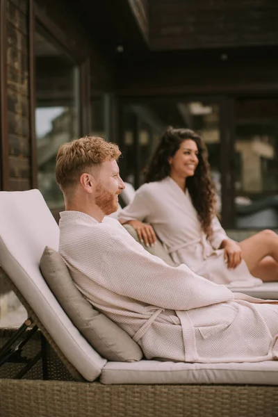 Handsome Young Couple Relaxing Beds Outdoor Terrace — Foto Stock