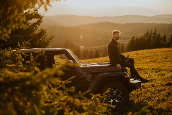 Handsome Young Man Relaxing Terrain Vehicle Hood Countryside — Stock Photo, Image