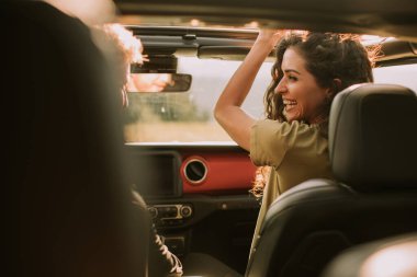 Young handsome couple having fun on roadtrip