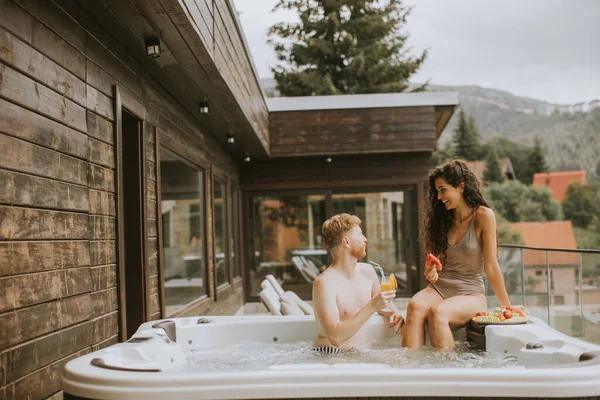 Attractive Young Couple Enjoying Outdoor Hot Tub Vacation —  Fotos de Stock