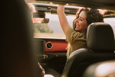 Young handsome couple having fun on roadtrip
