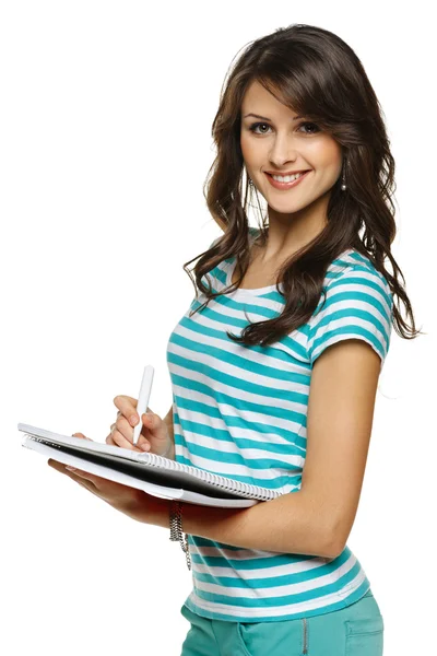 Woman making notes in the notebook Stock Photo