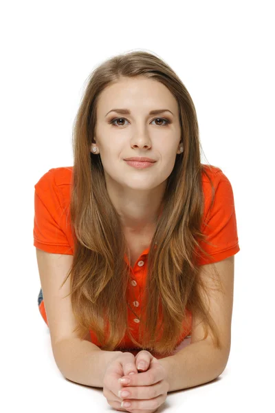 Woman lying on the studio floor — Stock Photo, Image