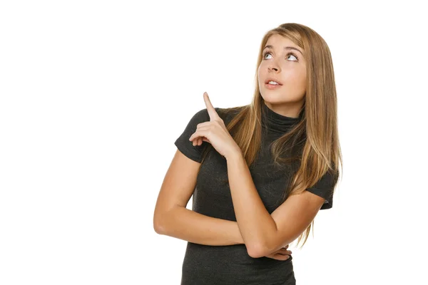 Mujer apuntando hacia arriba en el copyspace — Foto de Stock