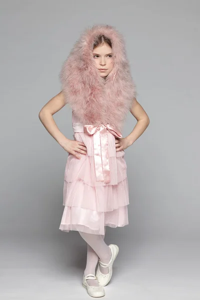 Girl in pink dress and fur mantle — Stock Photo, Image