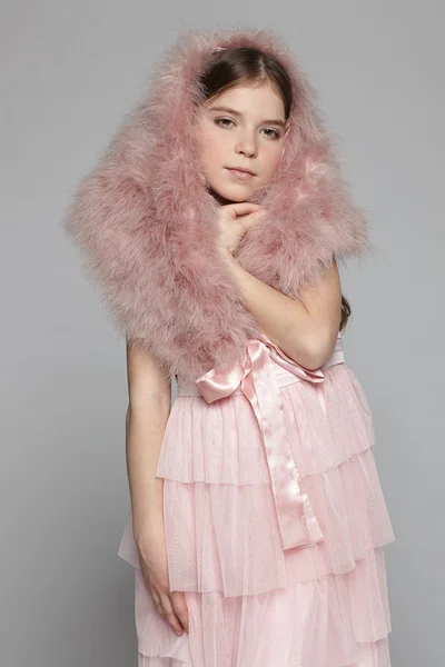 Girl in pink dress and fur mantle — Stock Photo, Image