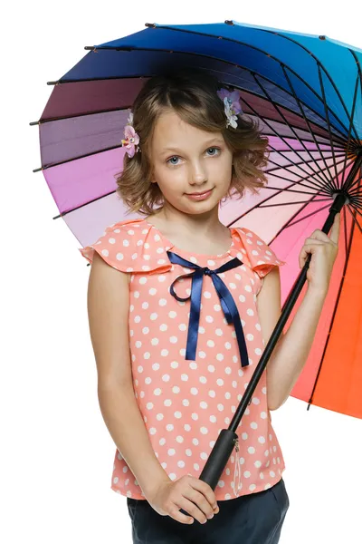 Little girl standing under colorful umbrella — Stock Photo, Image