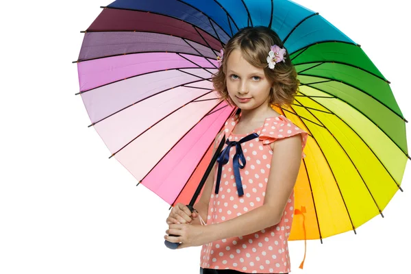 Little girl standing under colorful umbrella — Stock Photo, Image