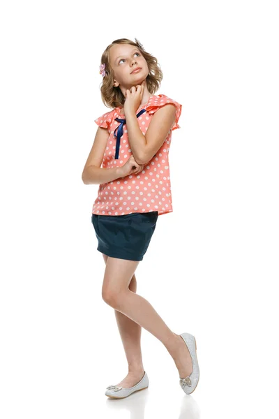 Little pensive girl with finger on chin — Stock Photo, Image