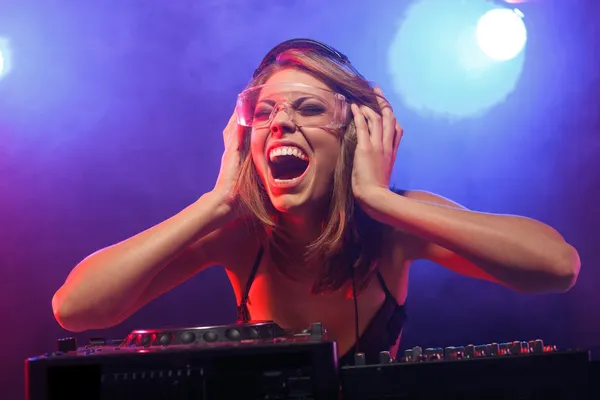 Excited DJ girl on decks on the party — Stock Photo, Image